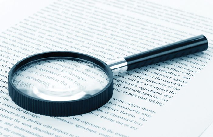 Magnifying-Glass-And-Text-Kindle-Contract-700x450.jpg