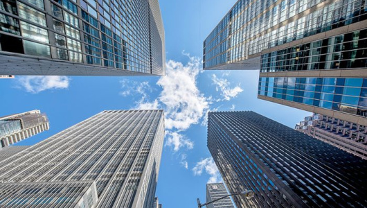 wealth-management-skyscrapers-blue-sky-530x300.jpg